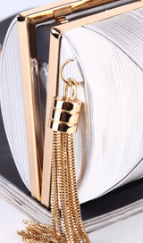Silk clutch with tassel pendant.